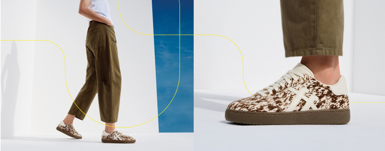 fitflop Sneaker mit Tierfellmuster auf weißem Hintergrund.