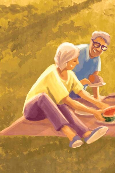 Seniorinnen genießen gemeinsam ein Picknick im Freien bei sonnigem Wetter.