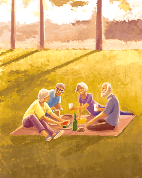 Seniorinnen genießen gemeinsam ein Picknick im Freien bei sonnigem Wetter.